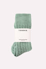 Green alpaca bed socks with 'Yonder' label on a white background