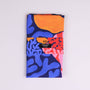 Colorful tea towel with abstract design on a white background
