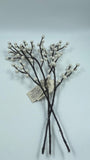Decorative branches with white berries on a light gray background