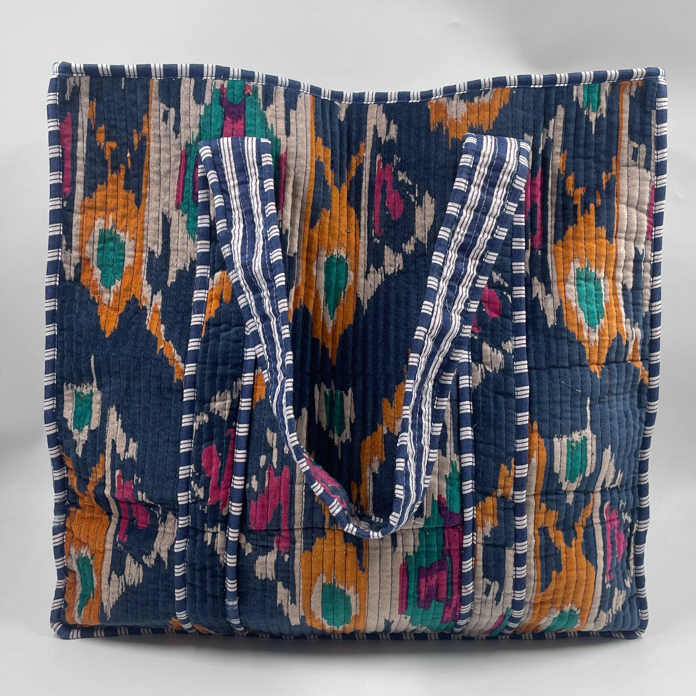 Colorful handbag with intricate patterns on a white background