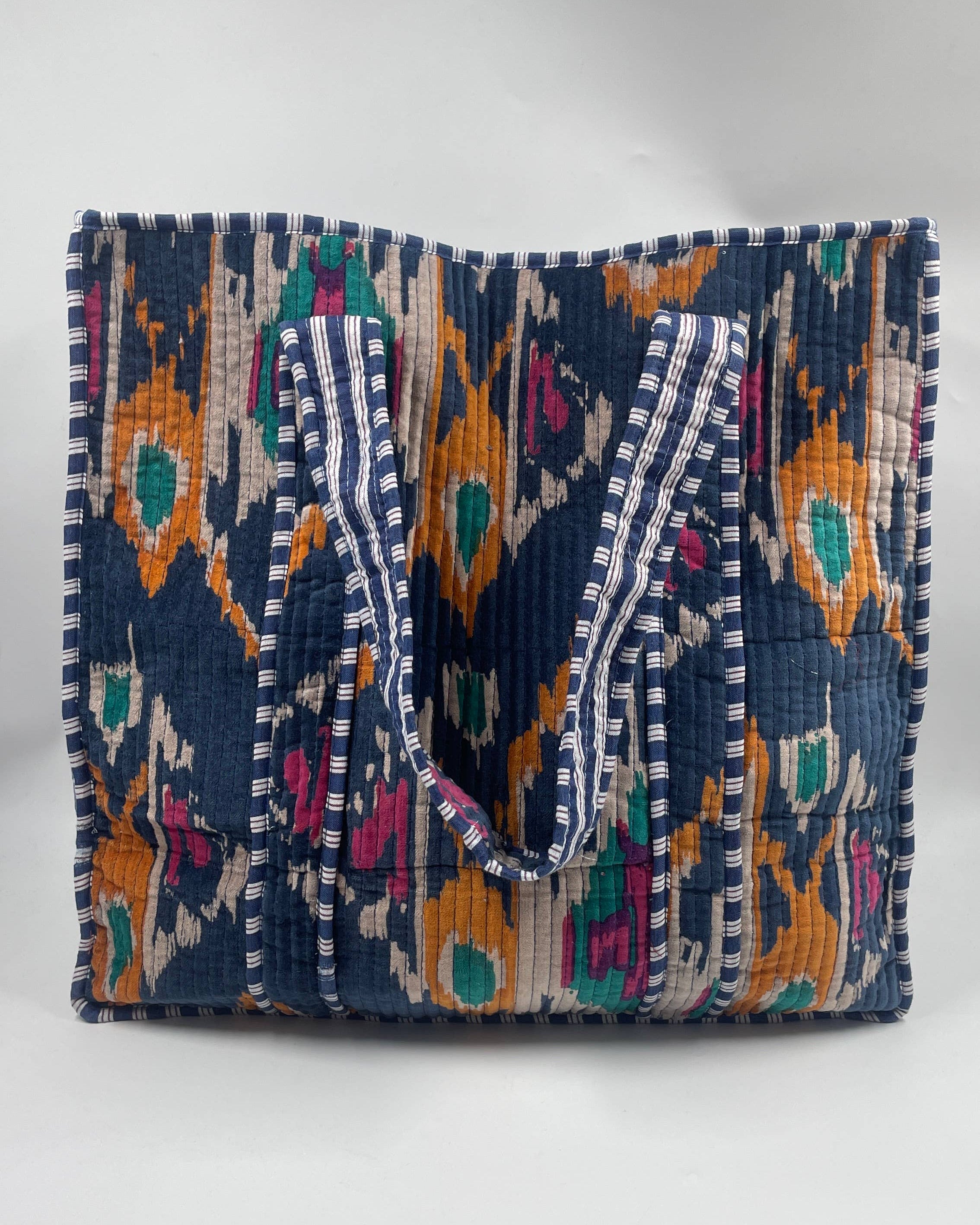 Colorful handbag with intricate patterns on a white background