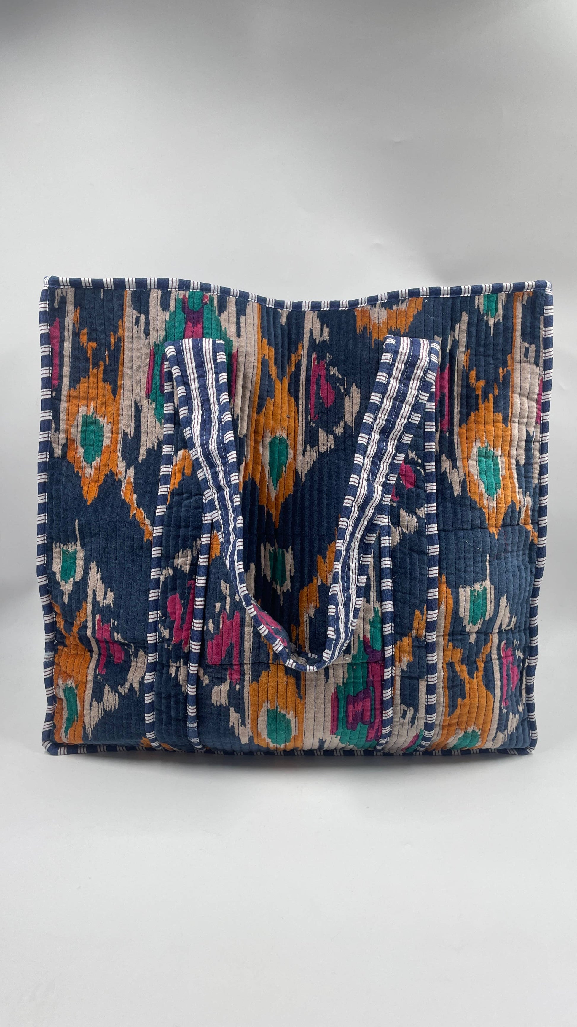 Colorful handbag with intricate patterns on a white background