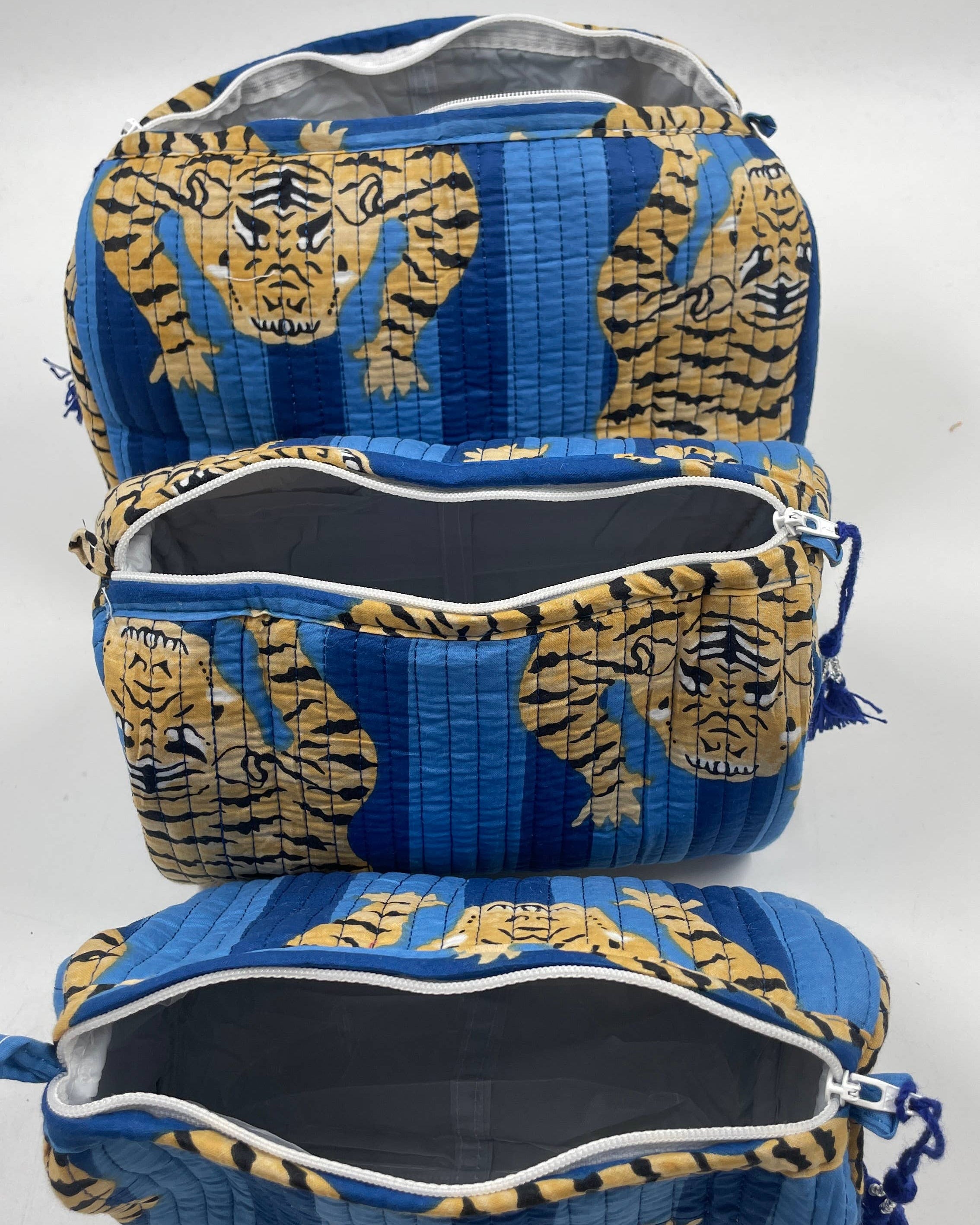 Blue and gold tiger-patterned bag on a white background