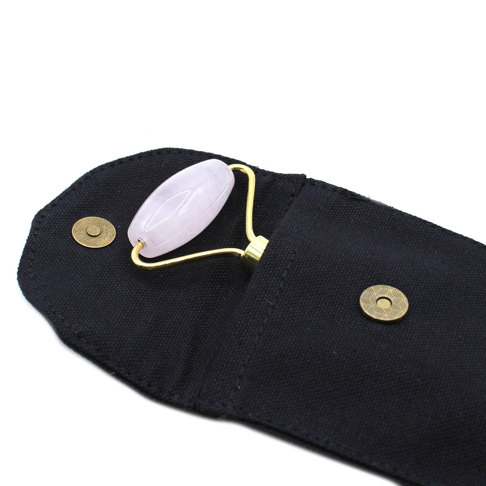 Black pouch with a white roller and gold accents on a white background