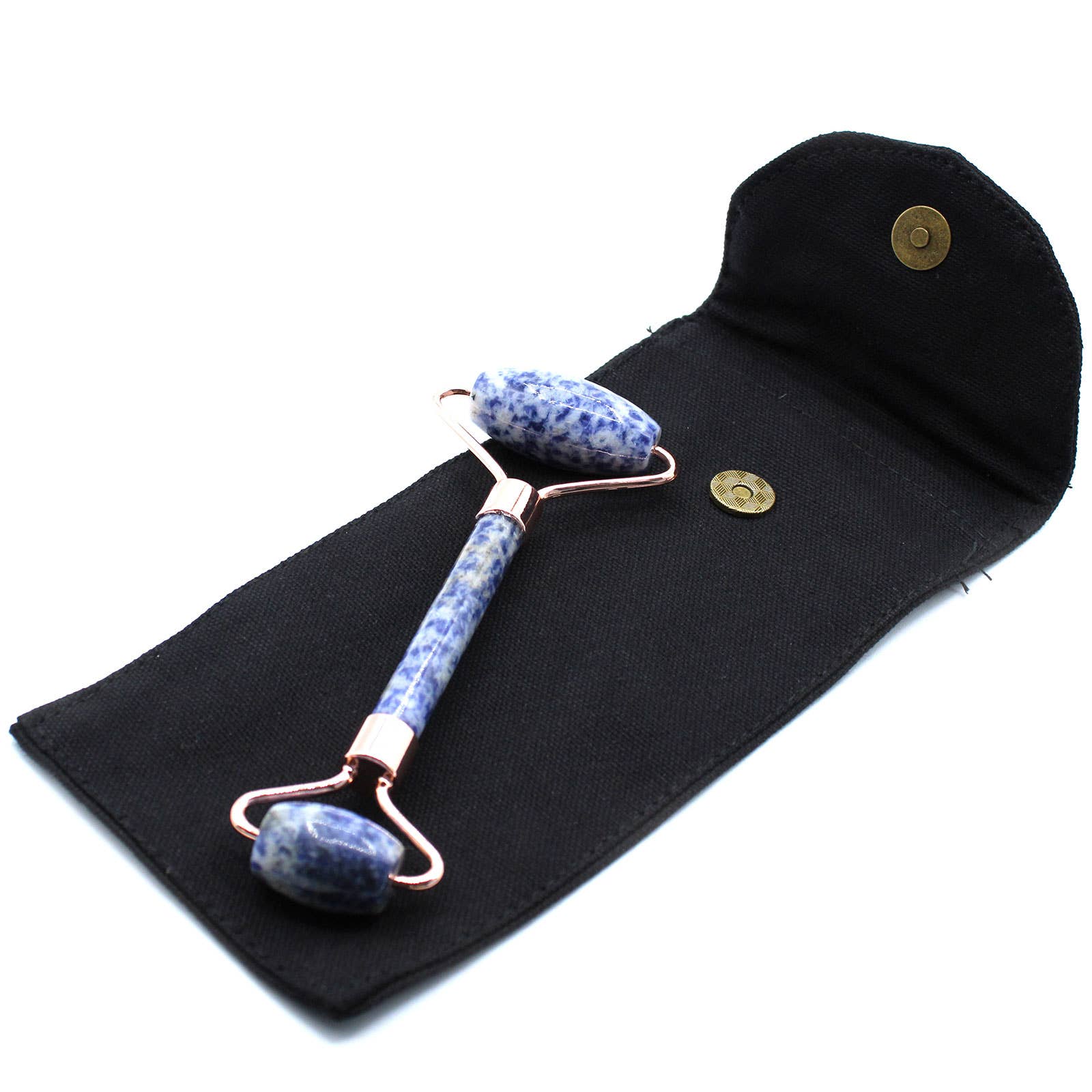 Gua Sha tool with blue stone handles on a black cloth background