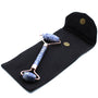 Gua Sha tool with blue stone handles on a black cloth background