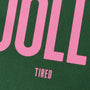 Close-up of a green and pink text design with 'UOLL' and 'TIRED'.