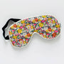 Floral patterned eye mask on a white background