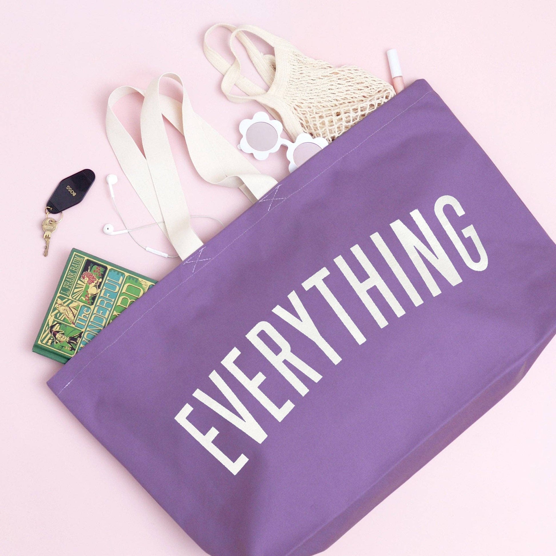 Purple bag with 'EVERYTHING' text on a pink background