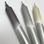 Three metallic pens with gradient colors on a white background
