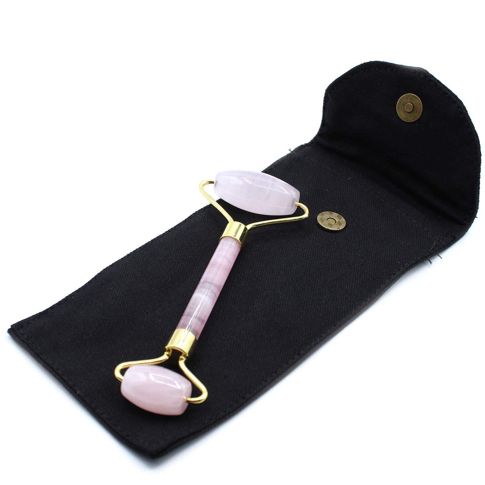 Rose quartz facial roller with gold accents on a black pouch