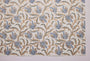 Patterned fabric with blue and brown floral design on a white background