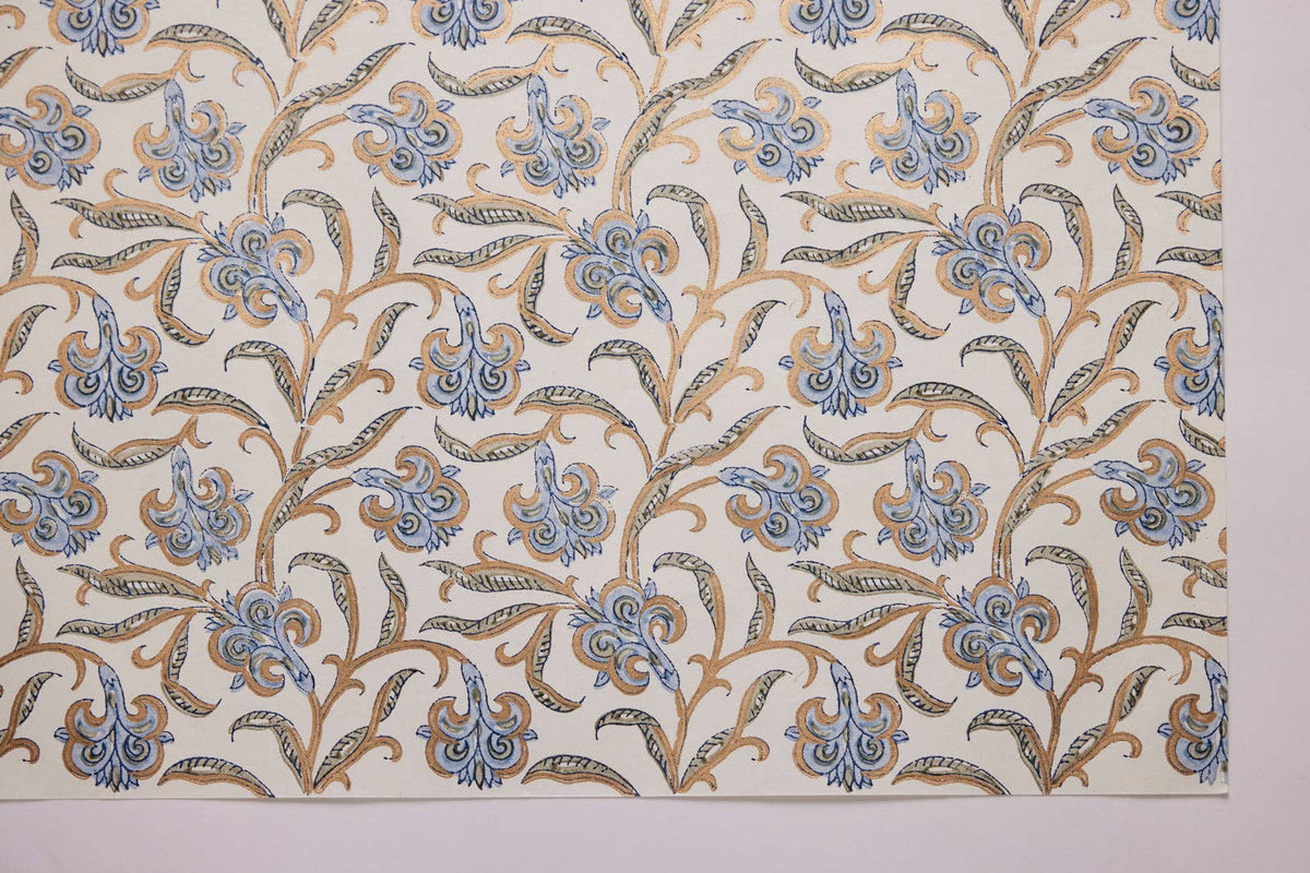 Patterned fabric with blue and brown floral design on a white background