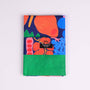 Colorful tea towel with vegetable pattern on a white background