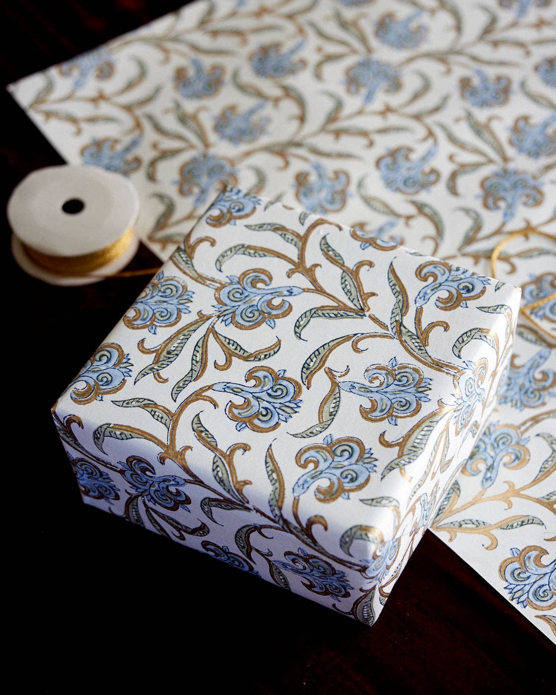 Decorative box with floral pattern on a matching fabric background