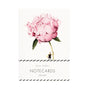 Notecard with a large pink flower and a person underneath on a white background