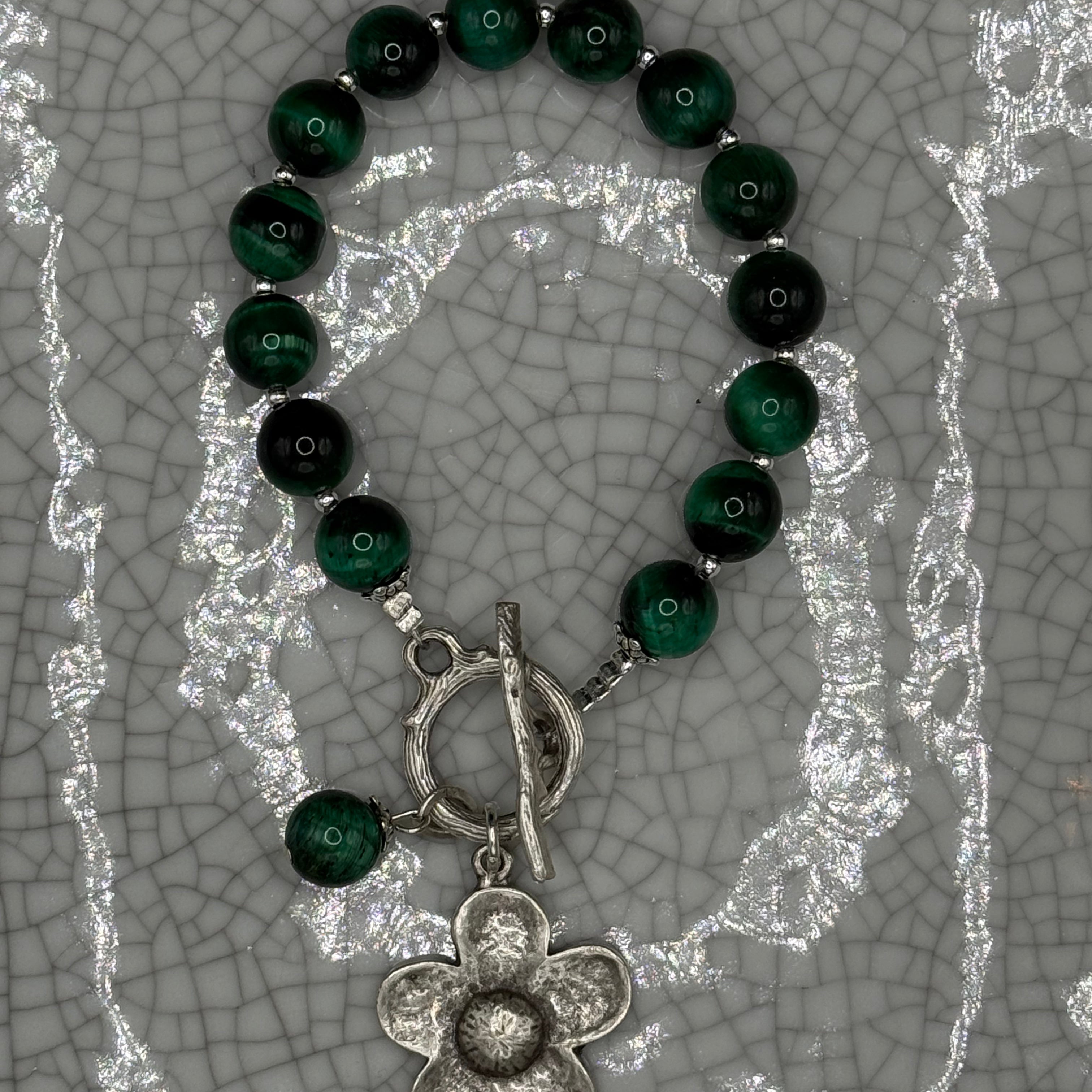 Green tiger's eye bead bracelet with silver flower charm, tiger's eye drop and T-bar clasp, handmade in Bristol