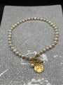 Freshwater pearl necklace with gold spacers, gold Roman coin charm, pearl drop and front T-bar clasp, handmade in Bristol