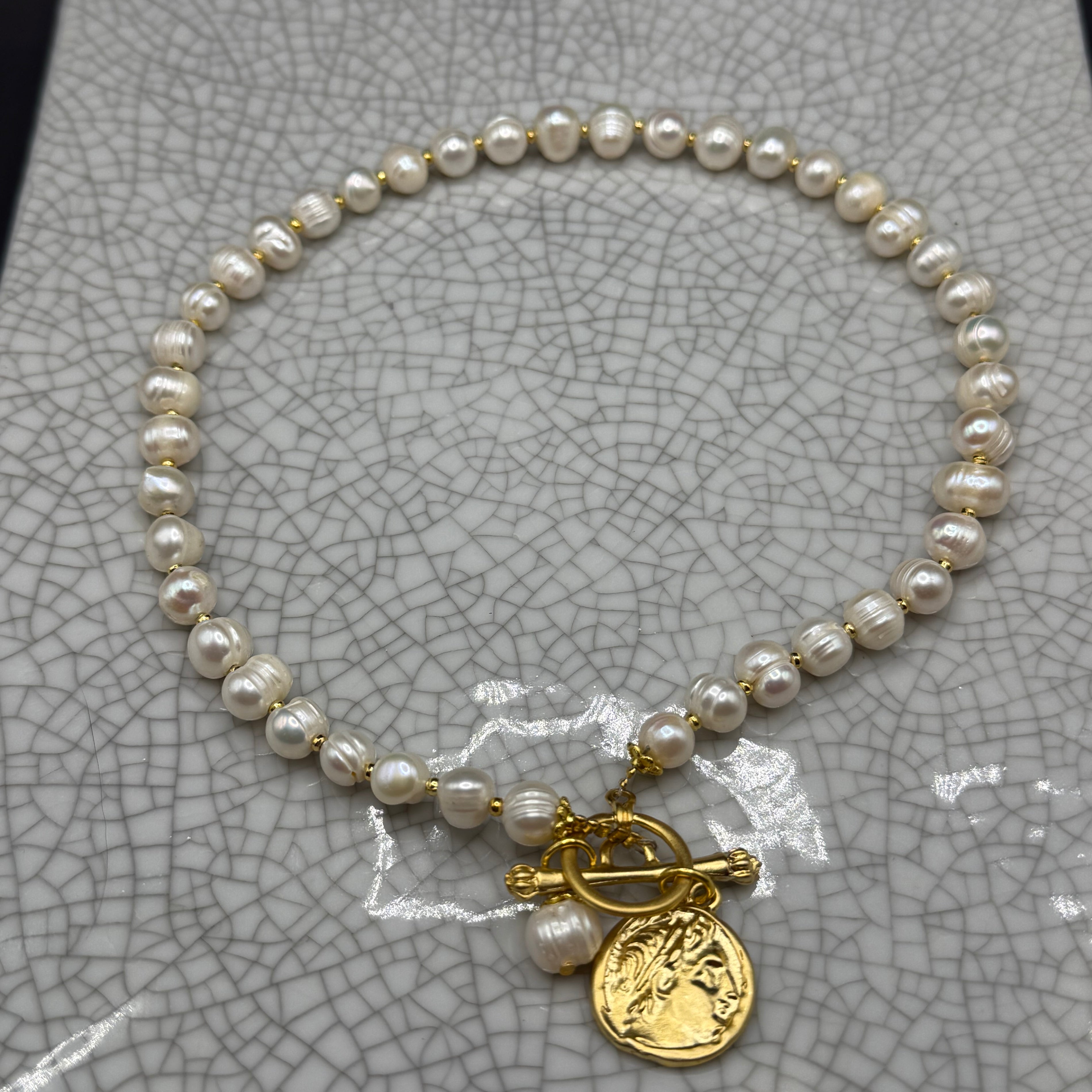 Freshwater pearl necklace with gold spacers, gold Roman coin charm, pearl drop and front T-bar clasp, handmade in Bristol