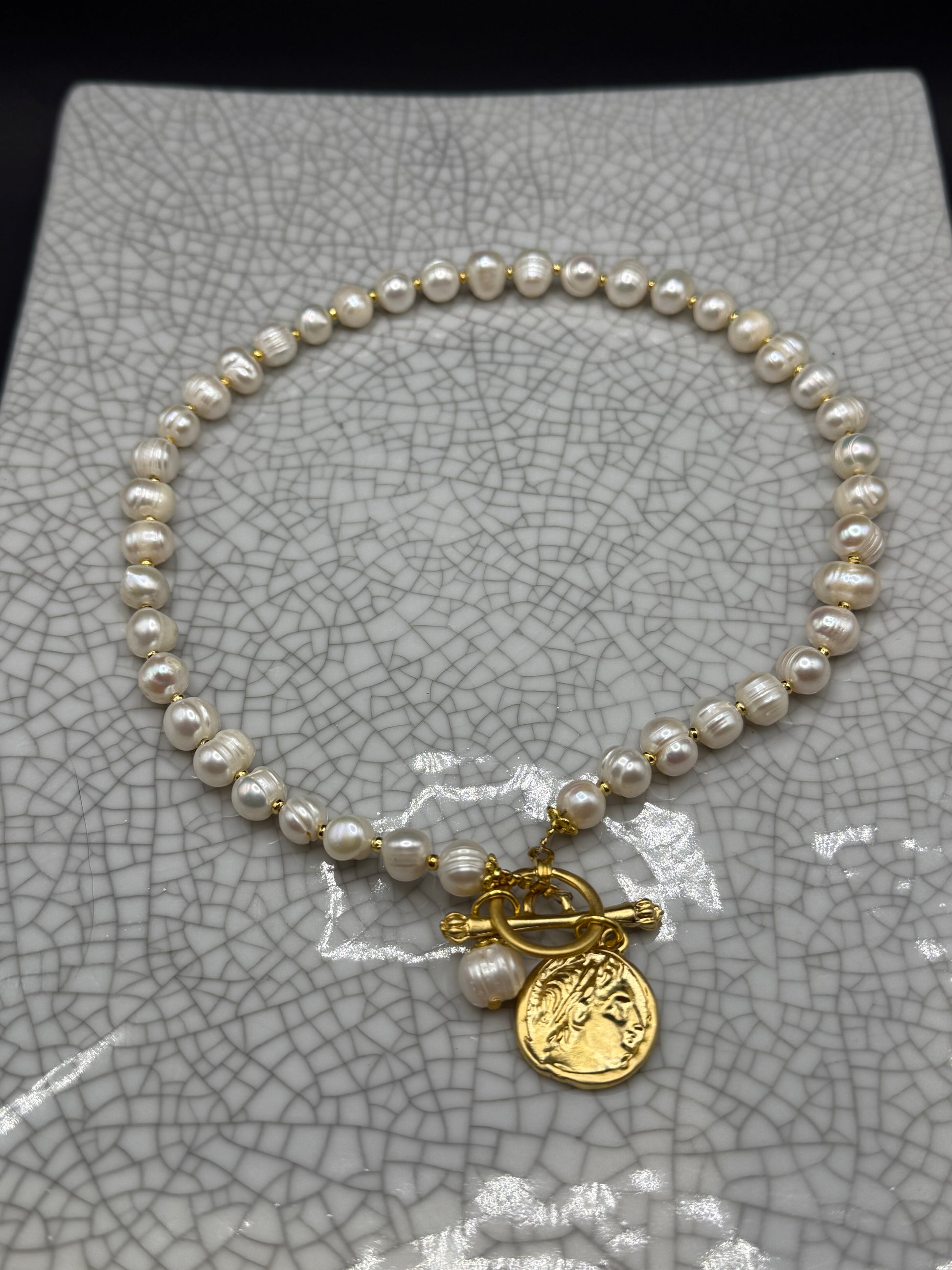 Freshwater pearl necklace with gold spacers, gold Roman coin charm, pearl drop and front T-bar clasp, handmade in Bristol