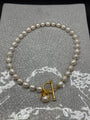 Freshwater pearl necklace with gold spacers, front T-bar clasp and pearl drop in a gold petal bud, handmade in Bristol