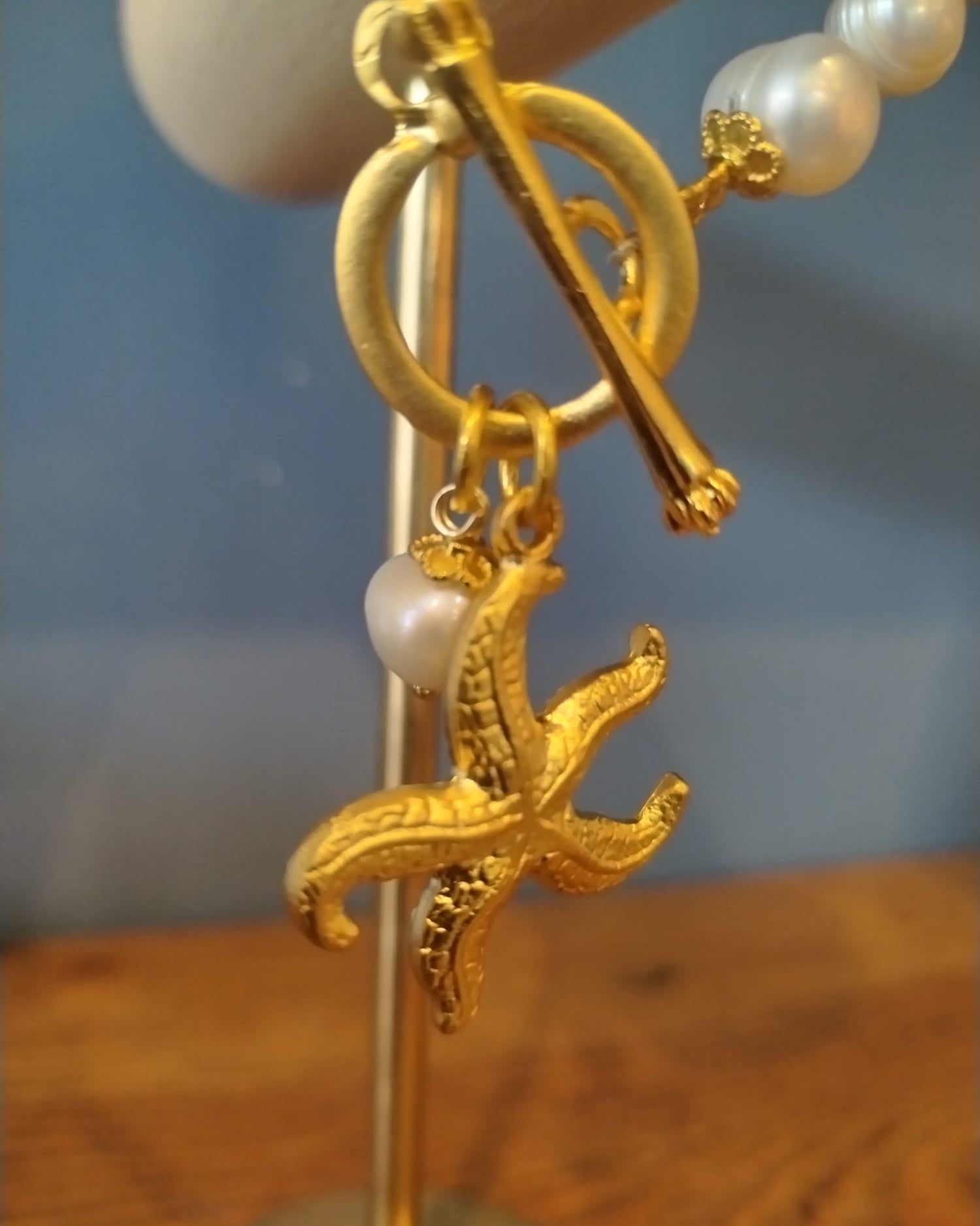 Freshwater Pearl Bracelet with a Gold Starfish Charm
