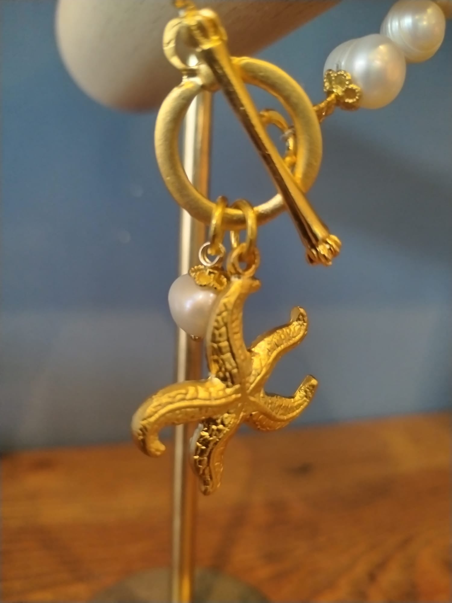 Freshwater Pearl Bracelet with a Gold Starfish Charm