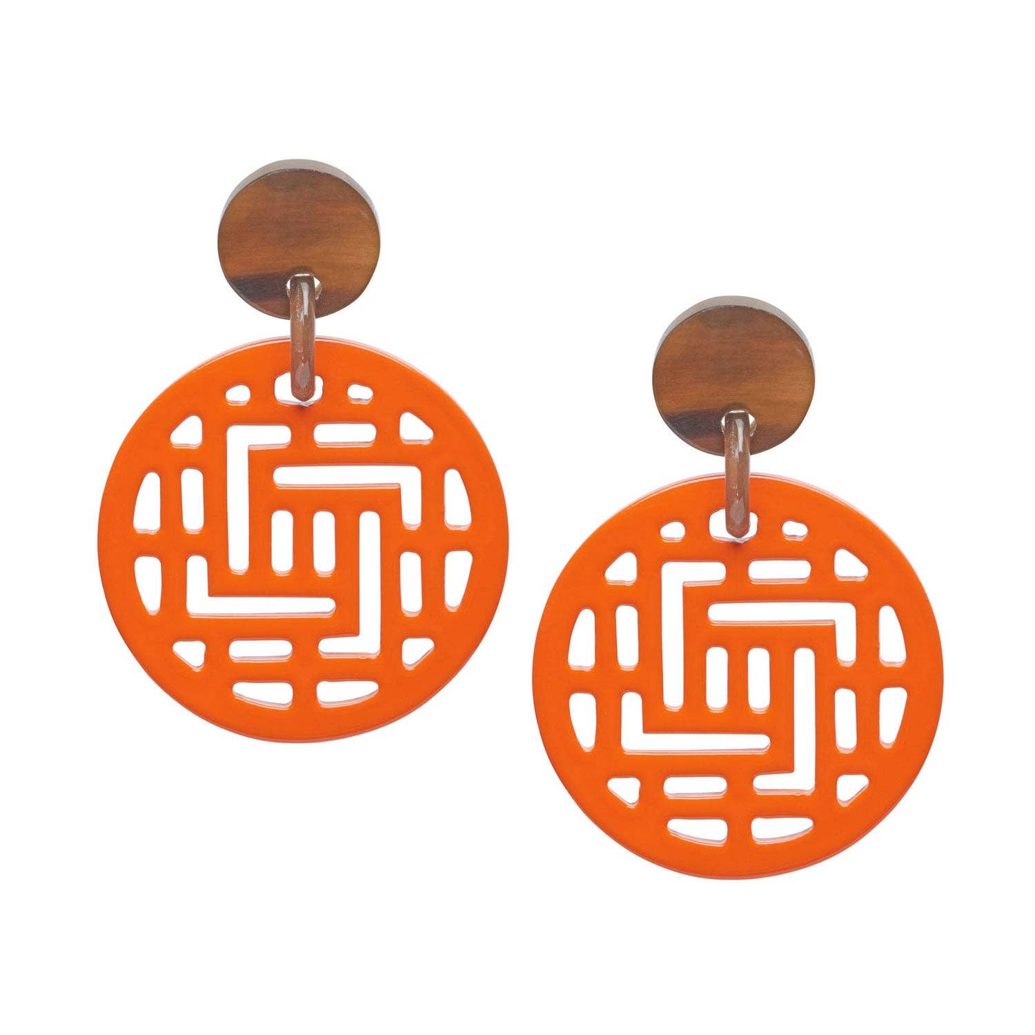 Pair of orange earrings with geometric design on a white background