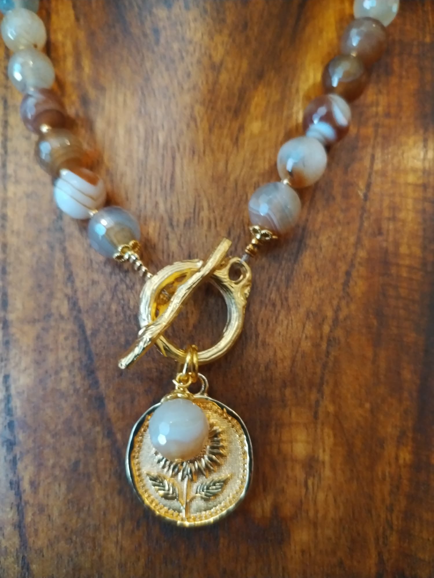 Elegant Brown Striped Agate Necklace With Gold Flower Charm