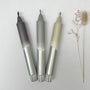 Three markers with gradient colors on a white background
