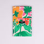Set of two floral tea towels with a visible brand label on a light gray background