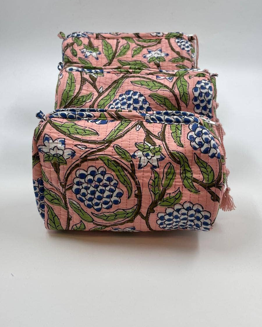 Set of two floral-patterned bags on a white background