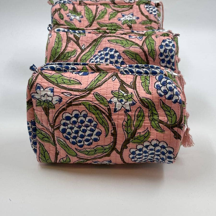Set of two floral-patterned bags on a white background