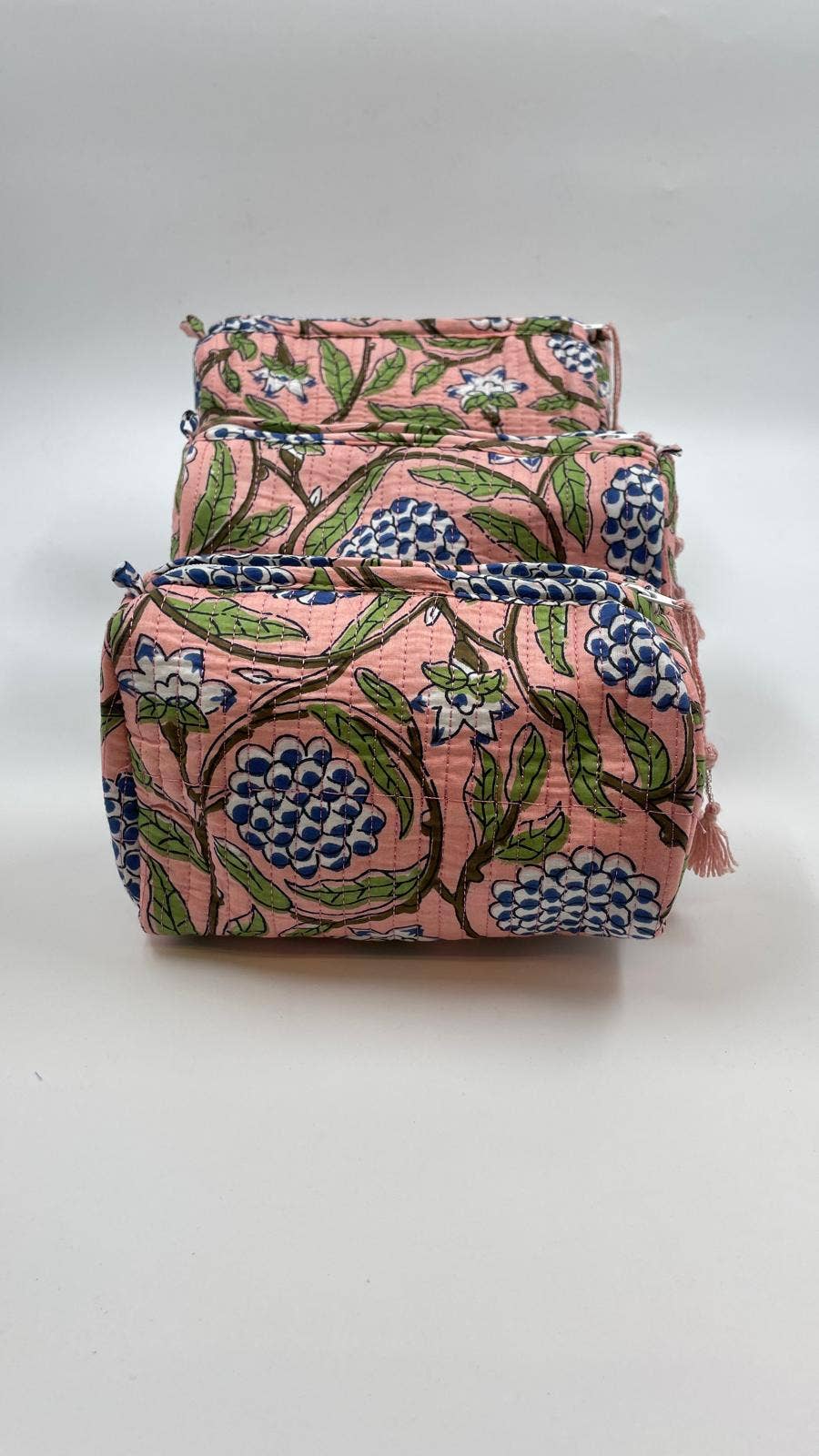 Set of two floral-patterned bags on a white background