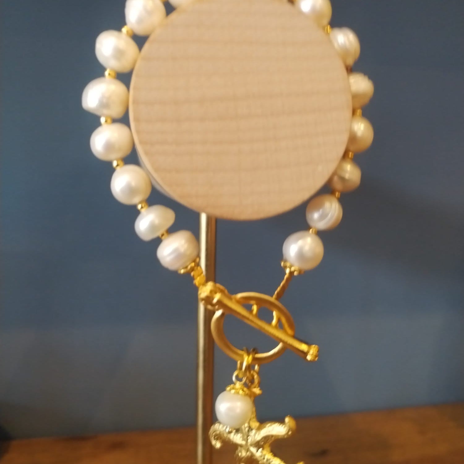 Freshwater Pearl Bracelet with a Gold Starfish Charm