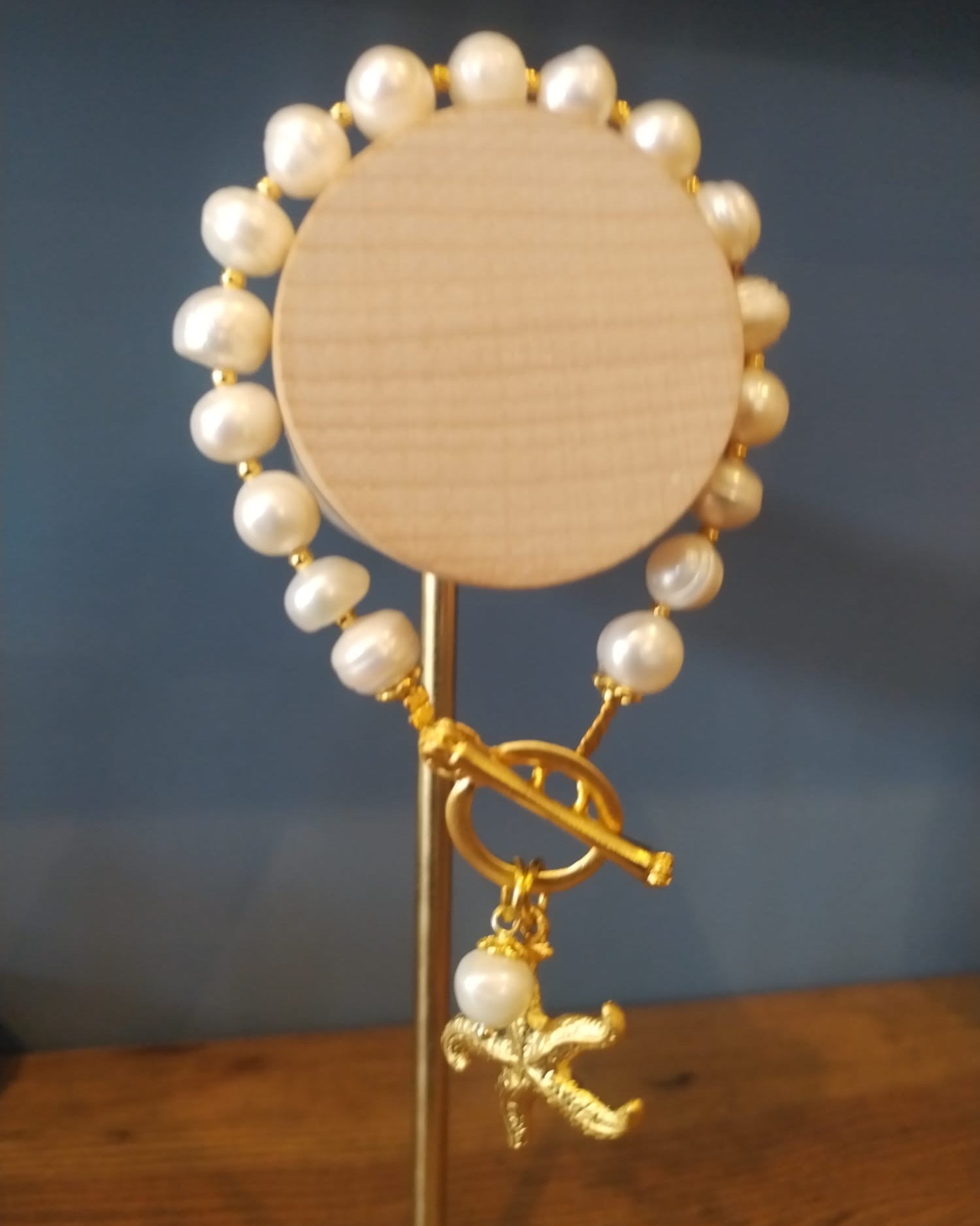 Freshwater Pearl Bracelet with a Gold Starfish Charm