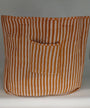 Striped bag with a pocket on a gray background