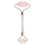 Pink facial roller with gold accents on a white background