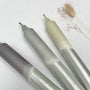 Three metallic pens with gradient colors on a white background