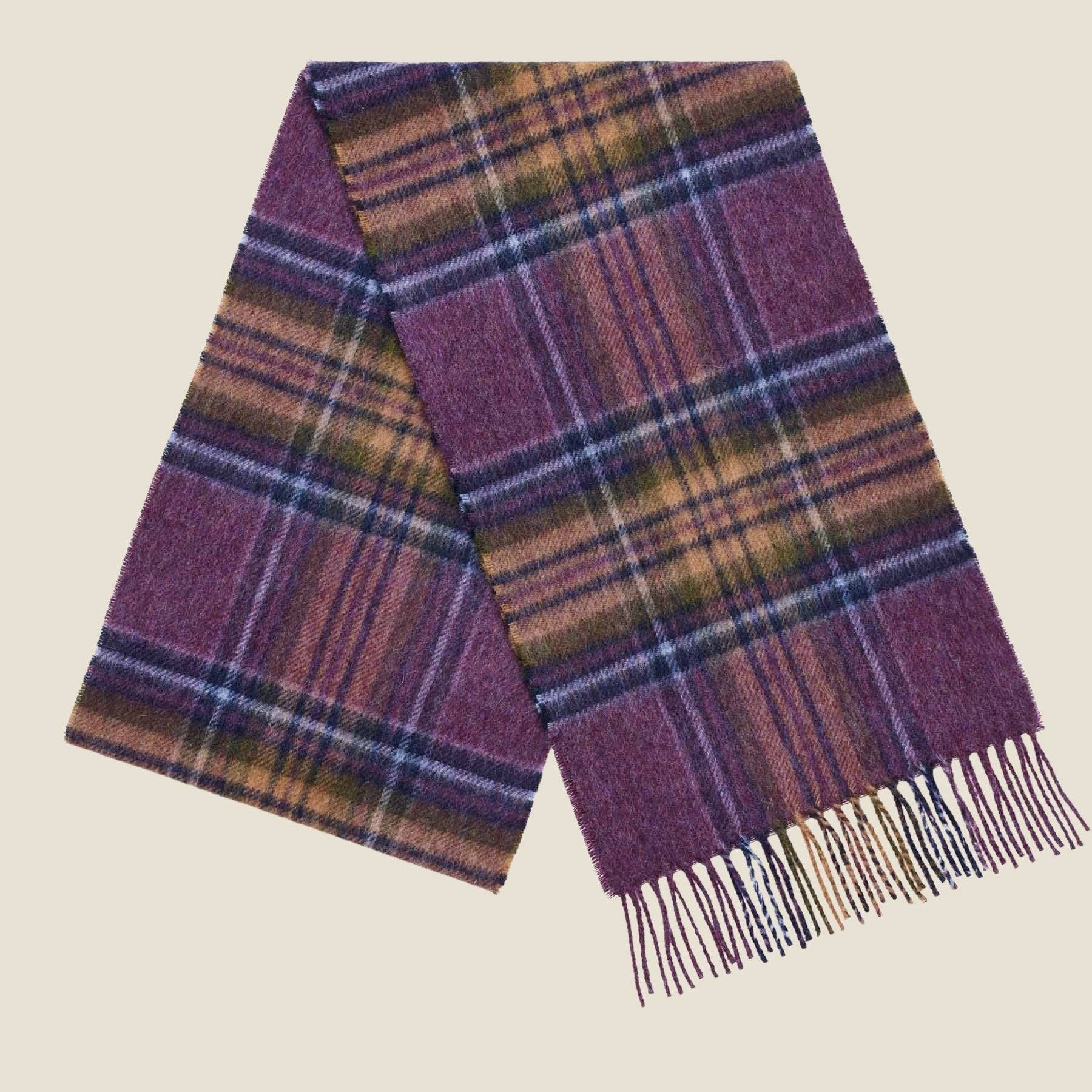 Plaid scarf with purple and brown colors on a beige background