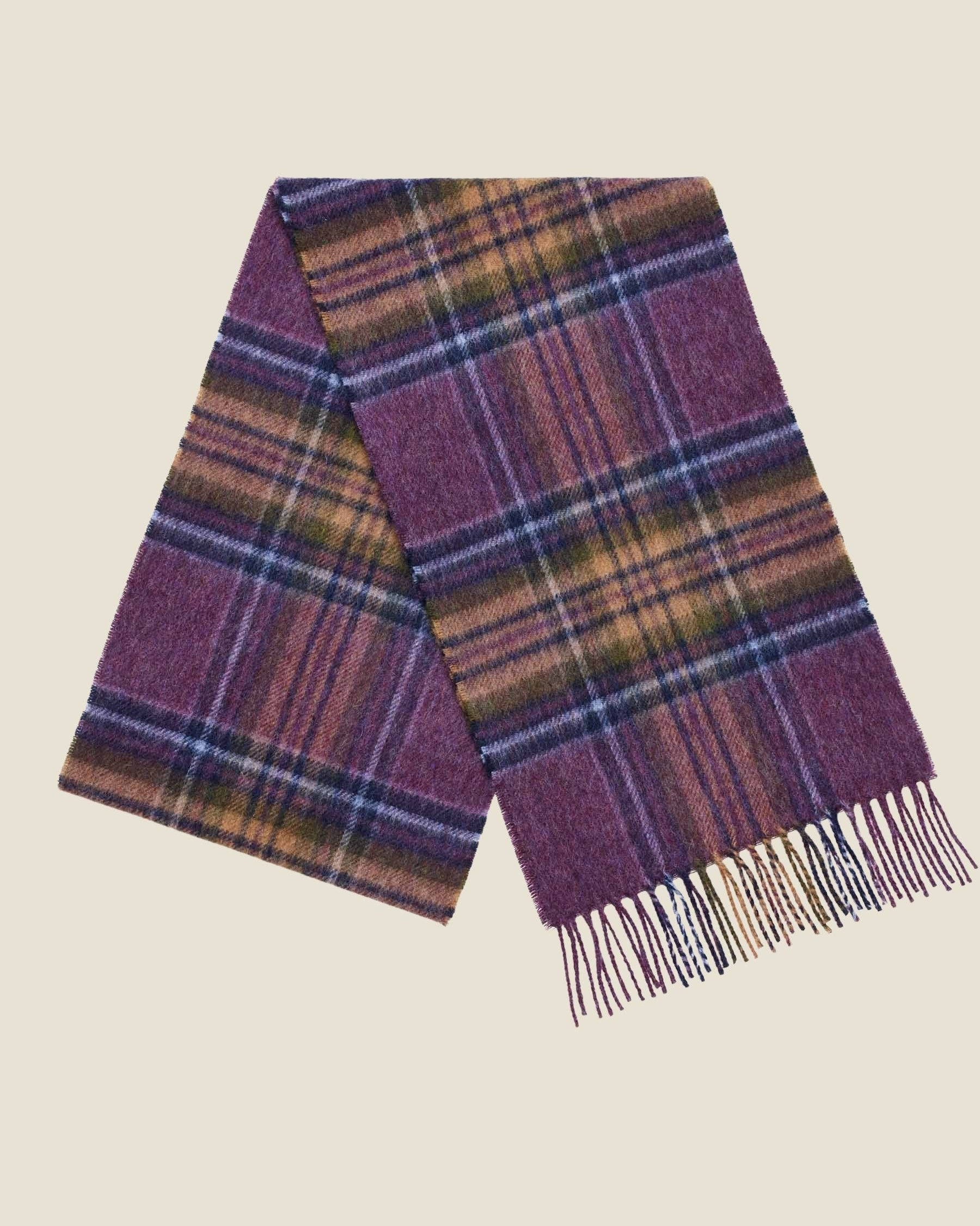 Plaid scarf with purple and brown colors on a beige background