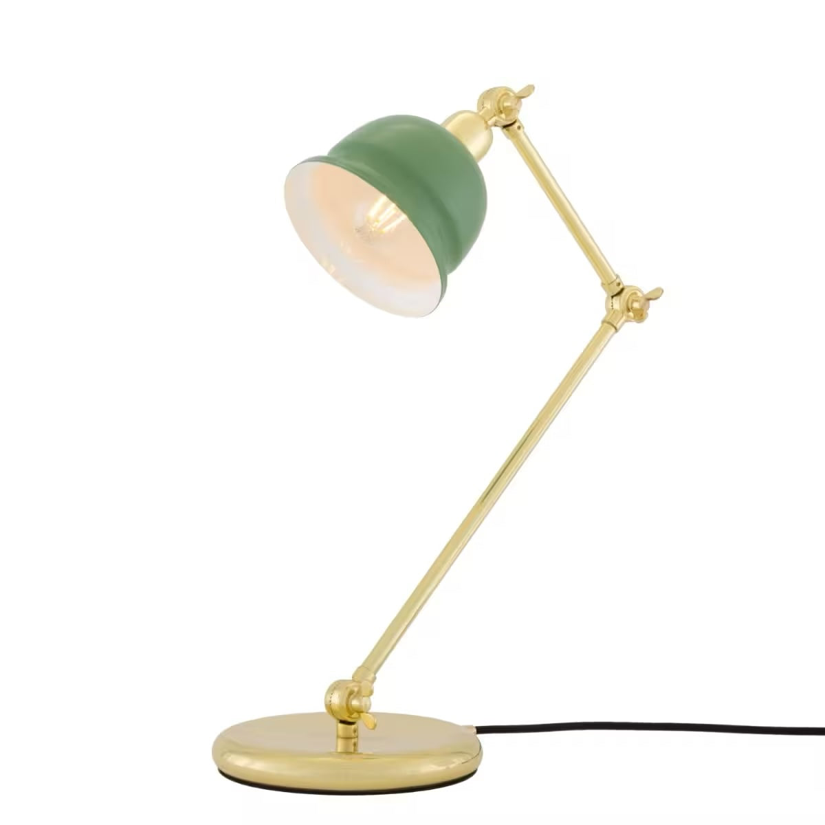Desk lamp with green shade and gold arm on a white background
