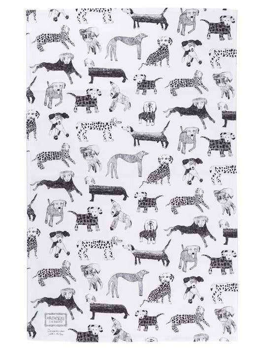 Patterned paper with black and white illustrations of dogs and plaid patterns on a white background.
