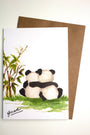 Greeting card with two pandas hugging and a tree, on a white background