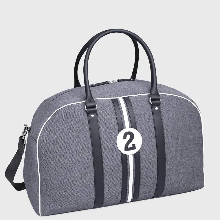 Gray travel bag with black handles and white stripe featuring number 2 on a light gray background