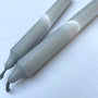 Two gray markers on a white background