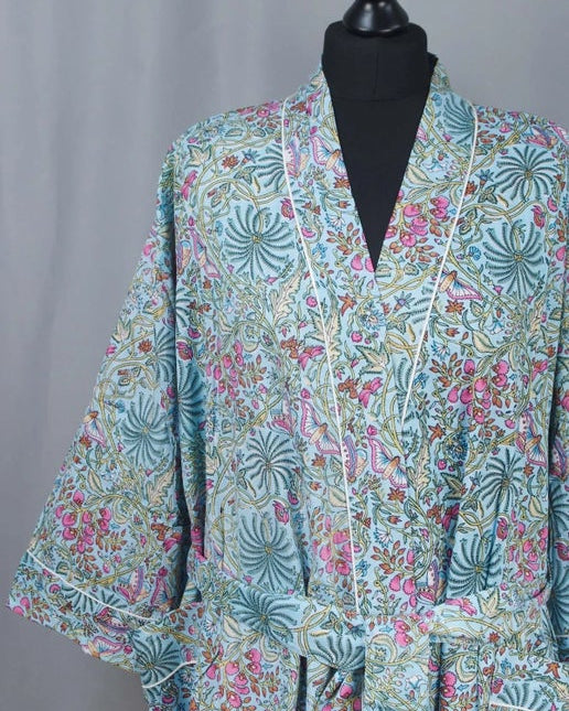 Floral patterned kimono on a mannequin against a gray background