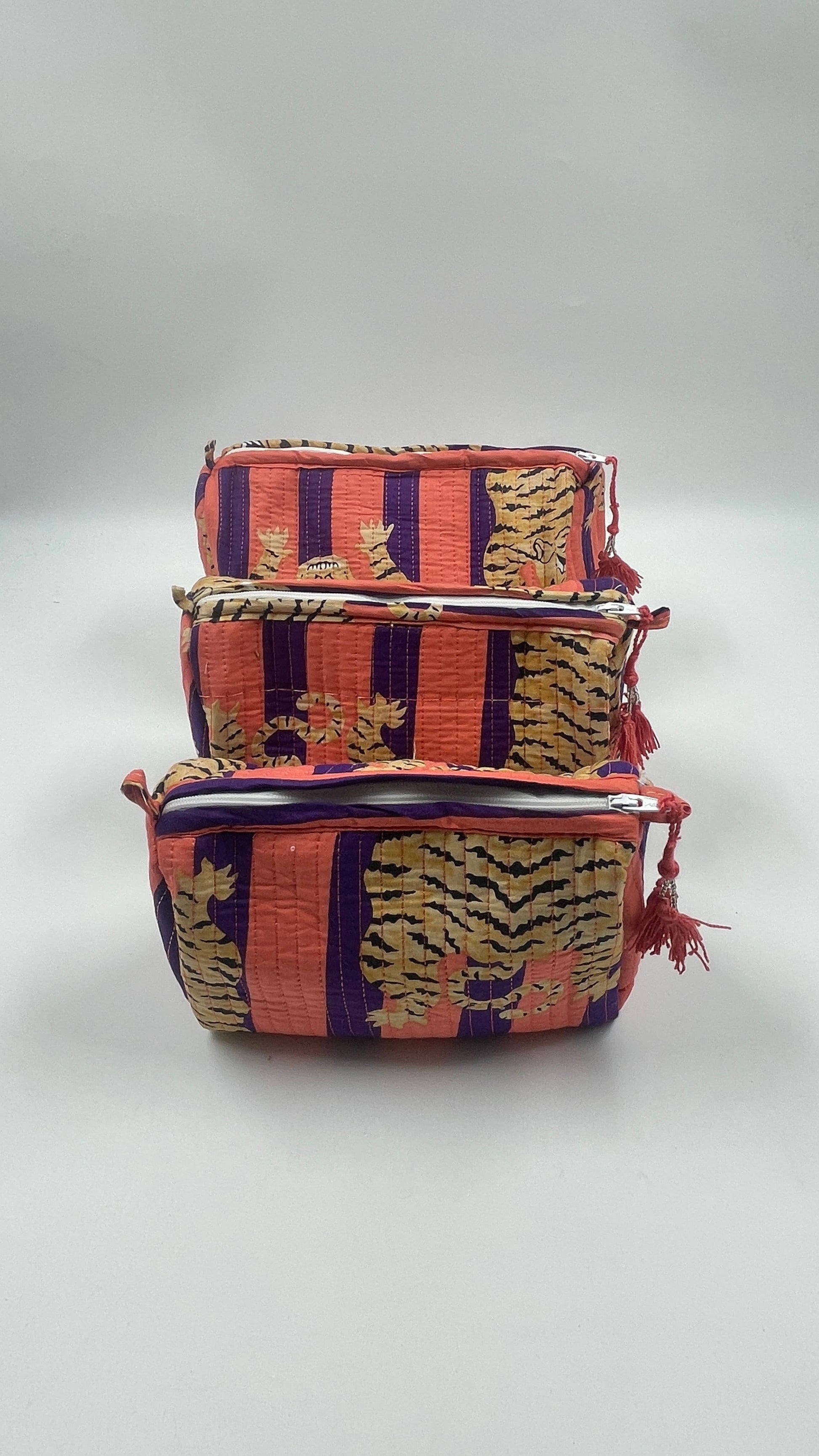 Tiger print cotton  quilted wash bag . Set of three