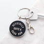 Keychain with 'Officially Quite a Good Dad' text on a white background