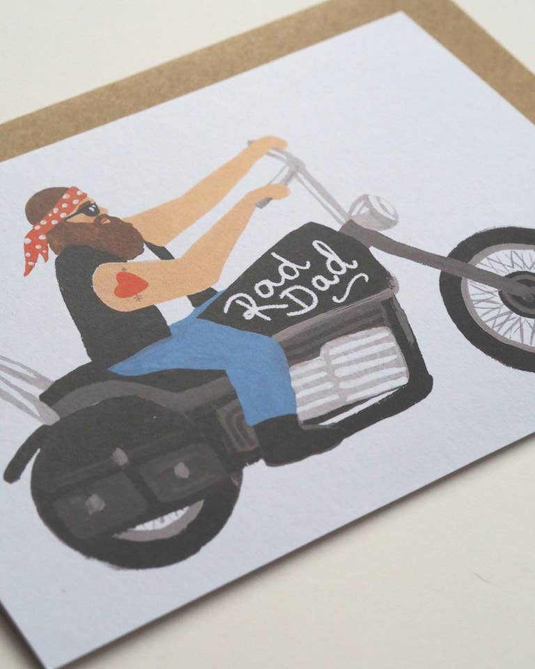 Card with illustration of a woman on a motorcycle wearing a bandana, with 'Rad Dad' text.